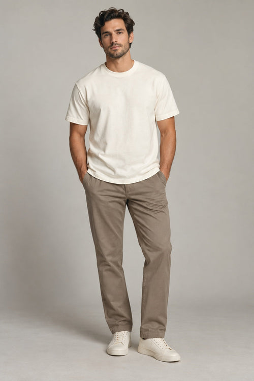 Male model wearing Avenor essential crewneck t-shirt in ivory